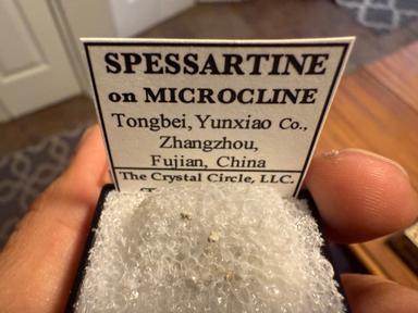 Spessartine on microcline